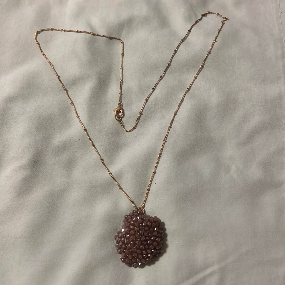 Amethyst color pendant on delicate goldstone chain